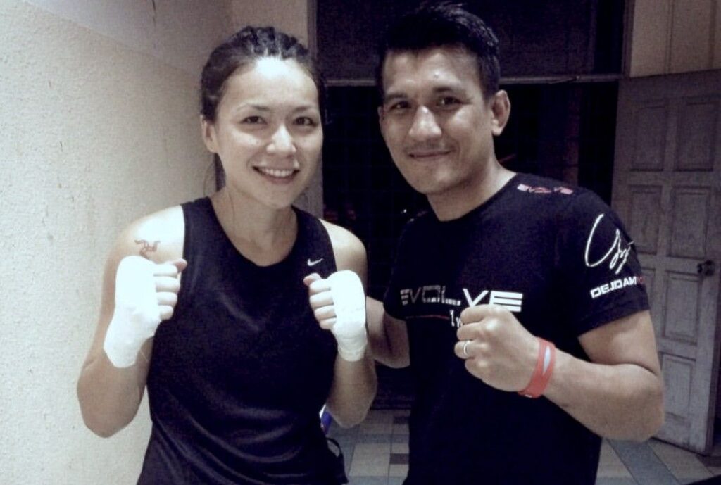 Multiple-time Muay Thai World Champion Namsaknoi Yudthagarngamtorn and his professional Muay Thai fighter girlfriend, Angie Wong.