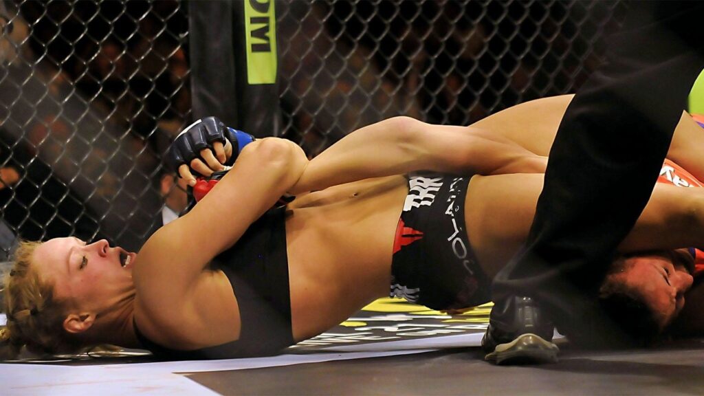121613-UFC-ronda-rousey-attempts-to-submit-miesha-tate-ahn-PI