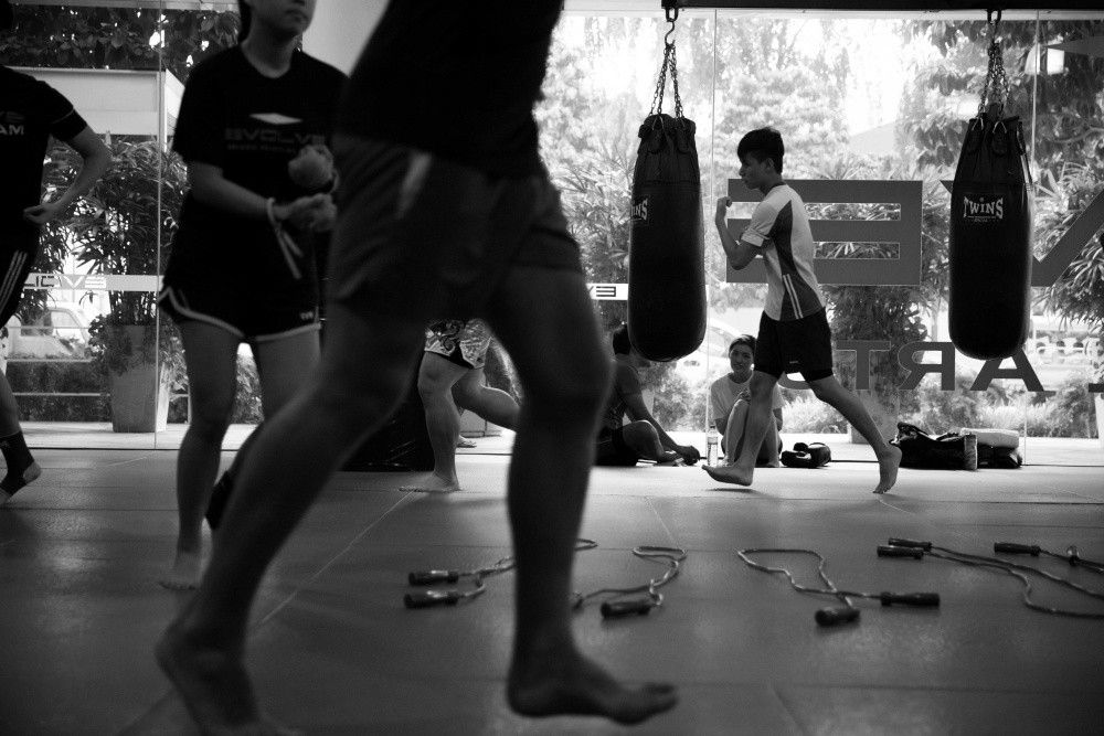 Muay Thai students warming up before a class. 