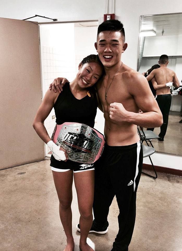 Christian and Angela pose for a photo op after one of Angela's amateur fights. 