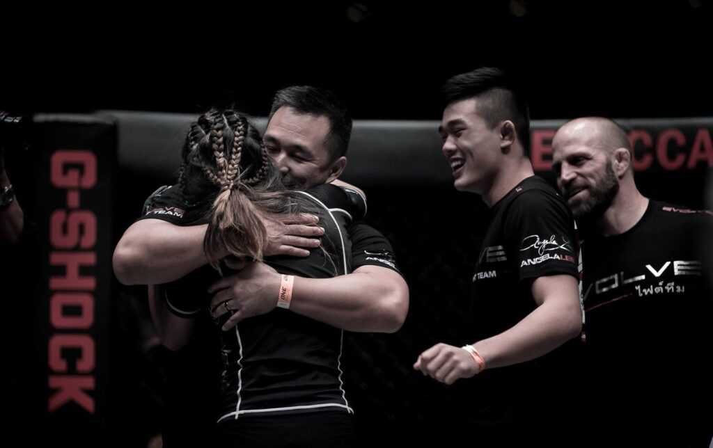 Angela hugs her dad after winning her last fight at ONE: Pride Of Lions. 